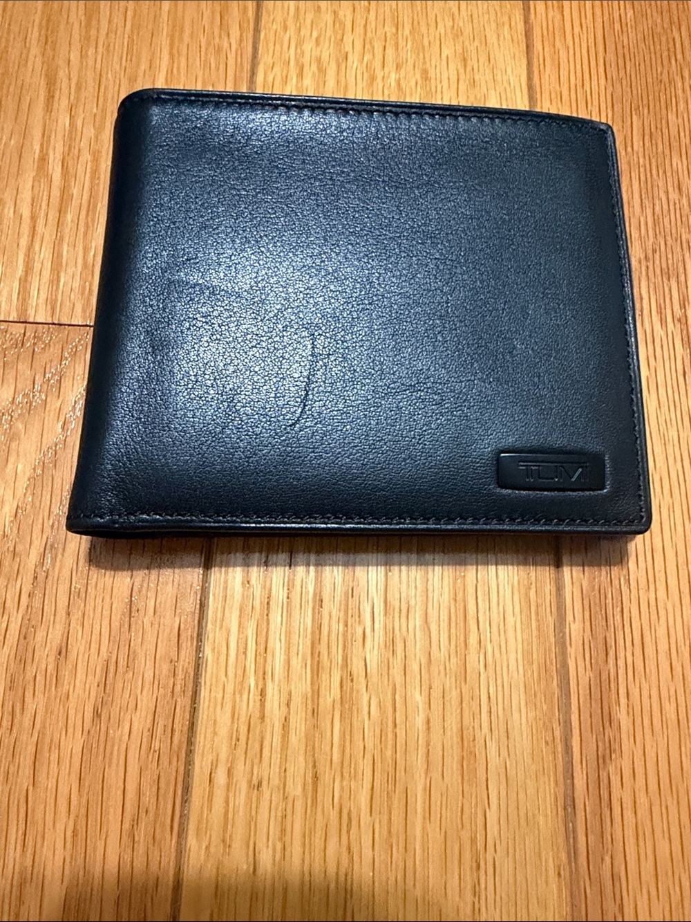 Tumi Hipster Black Leather Wallet with Subtle metal Logo
